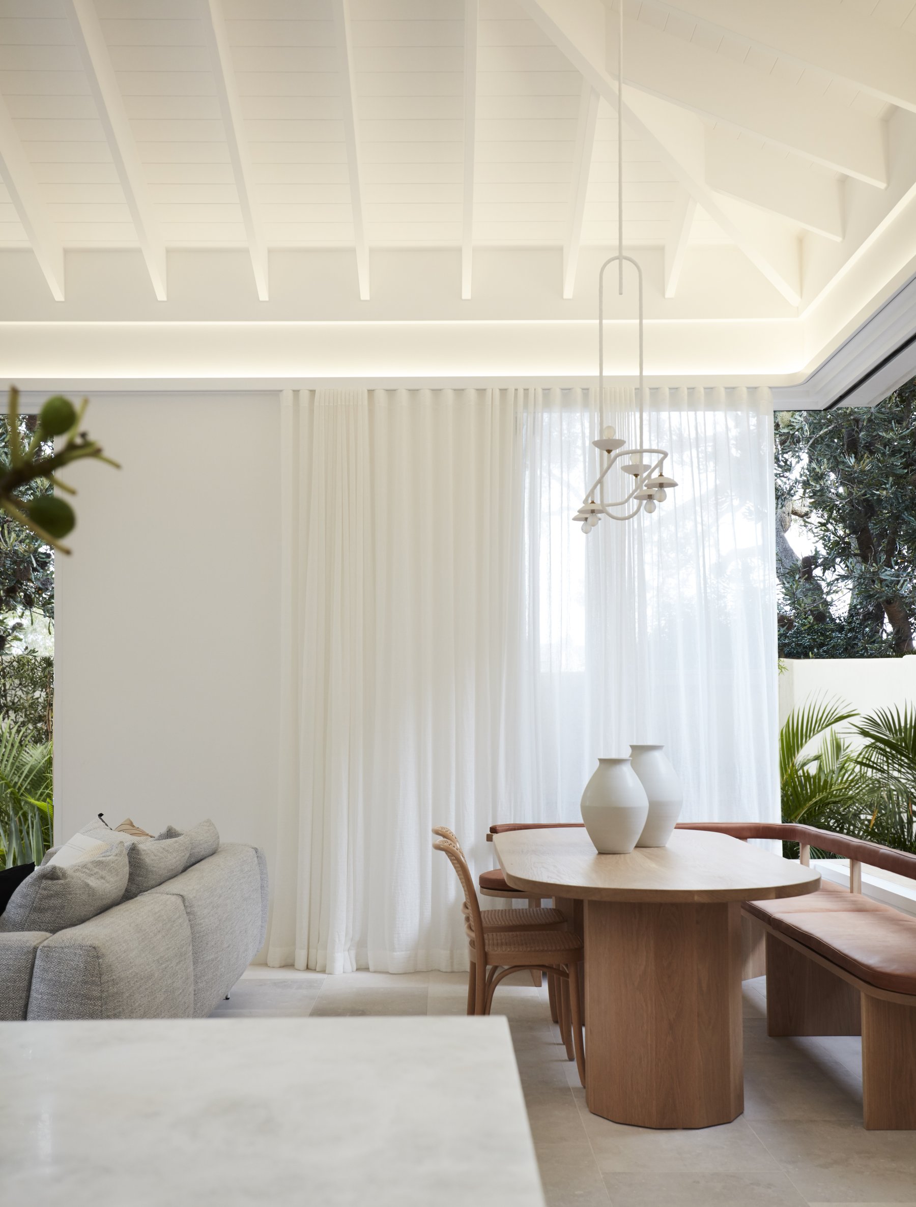 Sheer curtains catching natural light in a living space